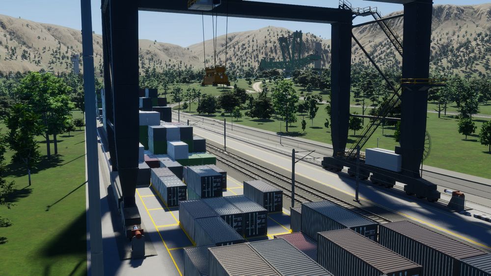 Capture d'écran du jeu Cities: Skylines 2 : le port sec et une foreuse au loin