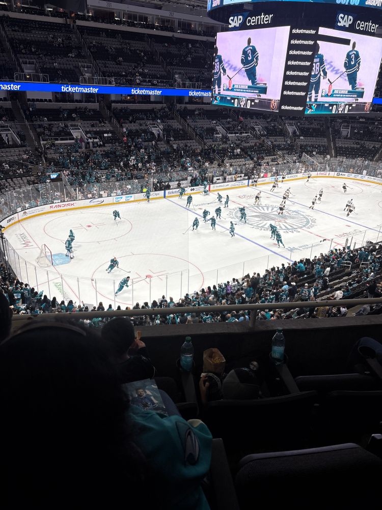 The ice at SAP center during warmups; the San Jose Sharks in teal in the near end, the Vegas Golden Knights (boo hiss) in away whites in the far end