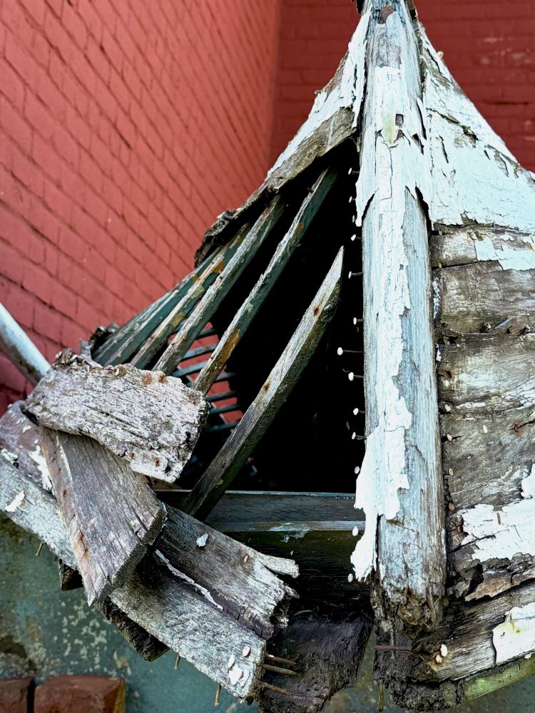 Old wooden boat, rotted wood leaving a row of nails exposed