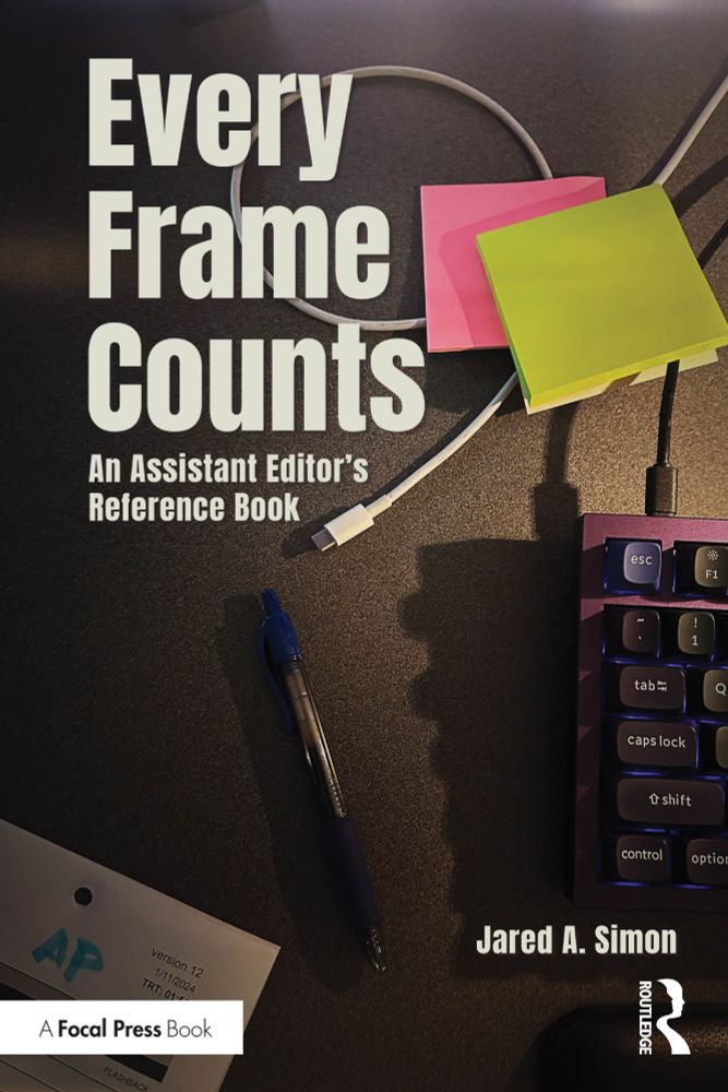 The cover art for my book "Every Frame Counts: An Assistant Editor's Reference Book". A top-down view of my desk, with some paperwork, a pen, two Post-Its and a cool purple keyboard.