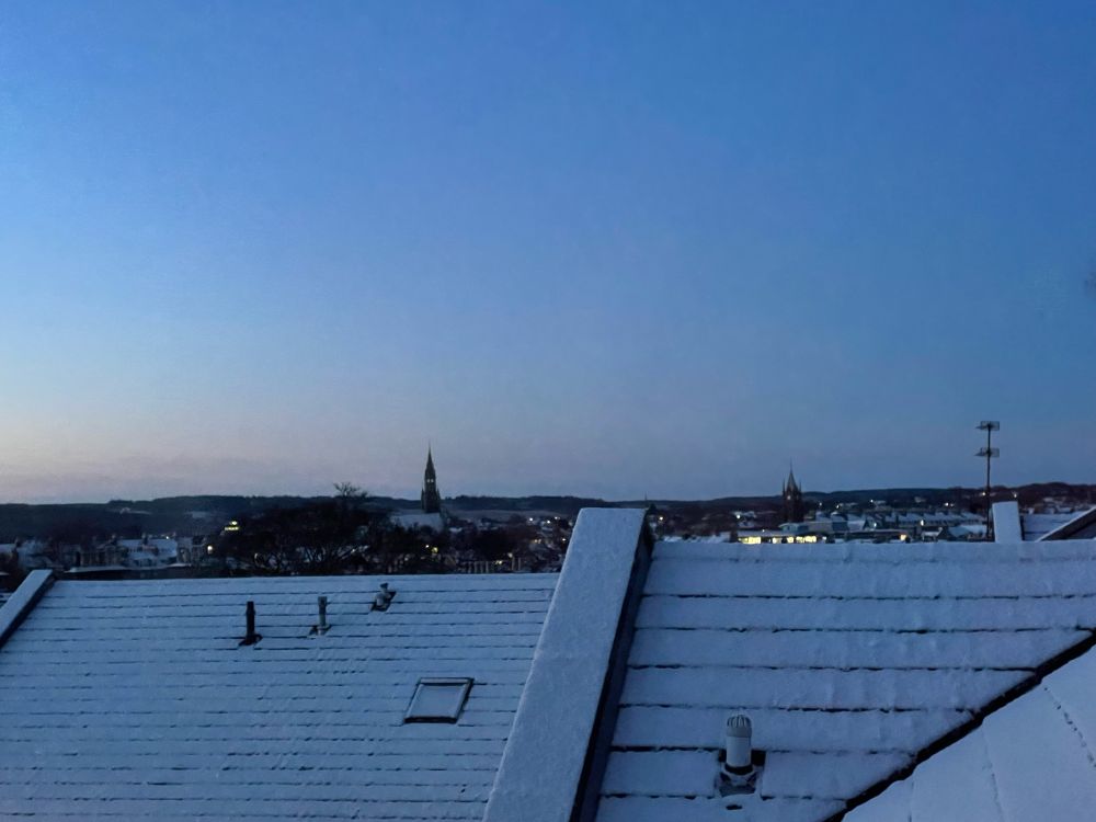 Snowy rooftops in Aberdeen at sunrise. 