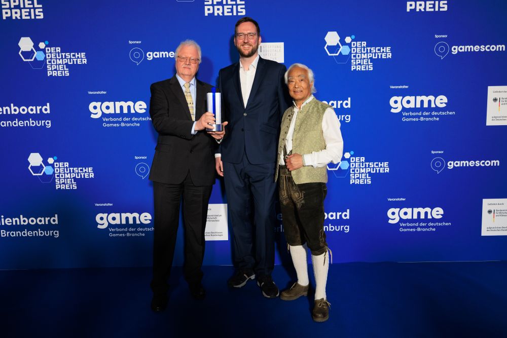 Rainer Krapohl und Steffen Bergmann vom FAMS mit dem Laudator Takeo Ischi beim DCP 2025.