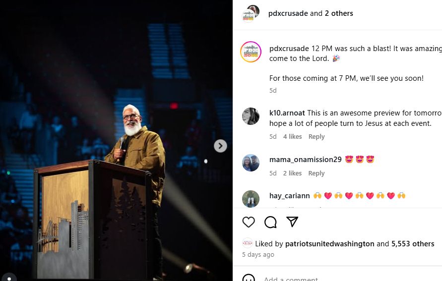 Image of white-haired white man on a stage at the Moda Center. PDXCrusade instagram post.