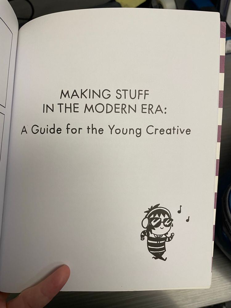 Photo of a page from “Herding Cats” by Sarah Anderson. Text reads “Making Stuff in the Modern Era: A Guide for the Young Creative” with a picture of the Sarah’s Scribbles character listening to music in the corner.