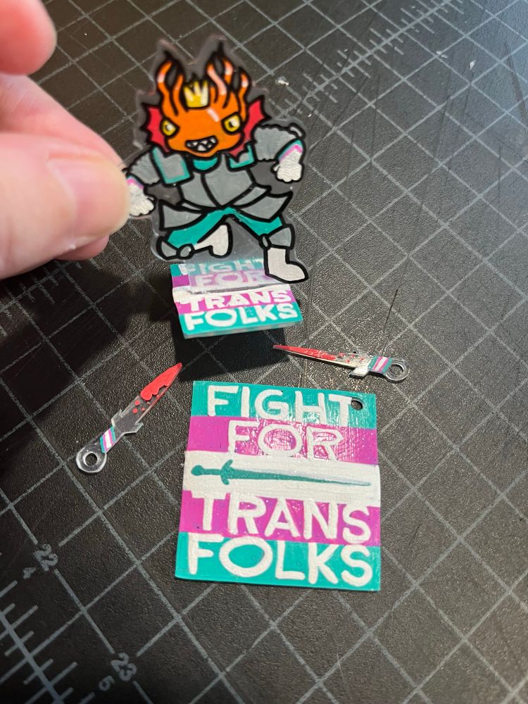 I’m making minifigs and charms that say “Fight for Trans Folks.”