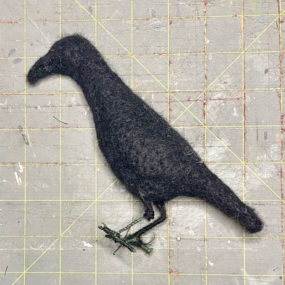 Base body for for "Avoid Shiny Objects" by Lynn Wartski.  Work-In-Progress (WIP) image of crow form.  Black needle felted wool over wire and batting armature form.  