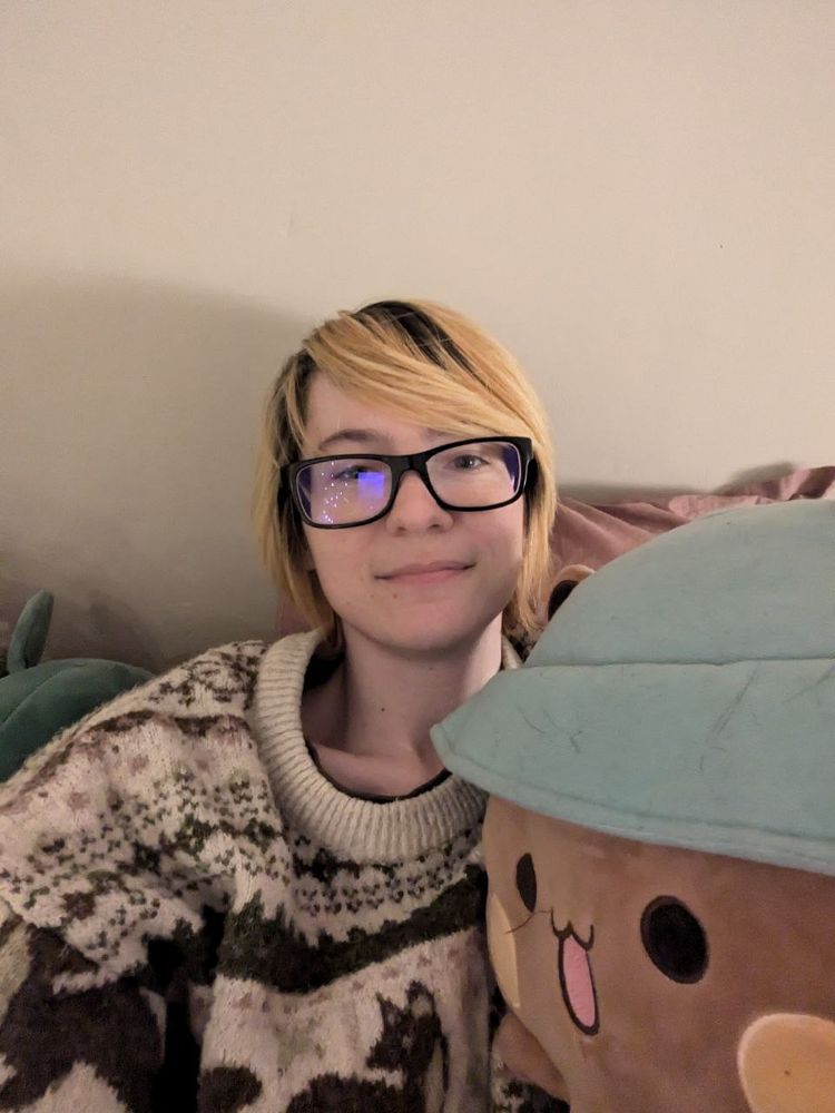 Photo(selfie) of blond haired person with thick framed glasses.