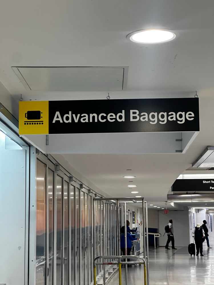 Airport sign reads “advanced baggage”