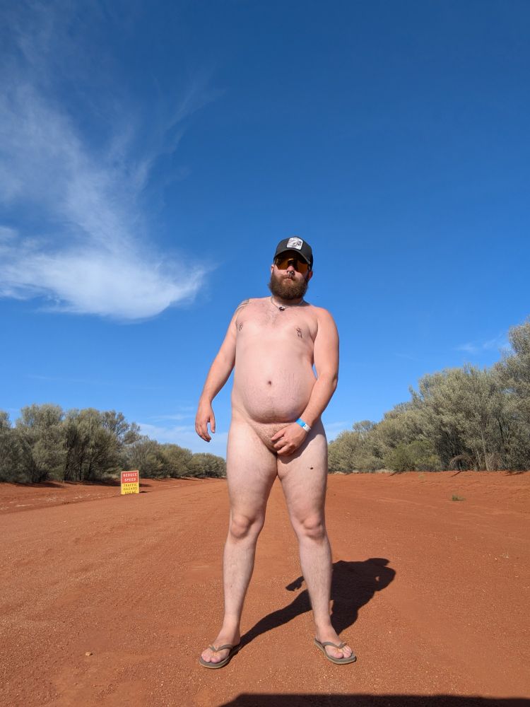 Pale naked cub covering his bits in an attempt to stop the "dust"