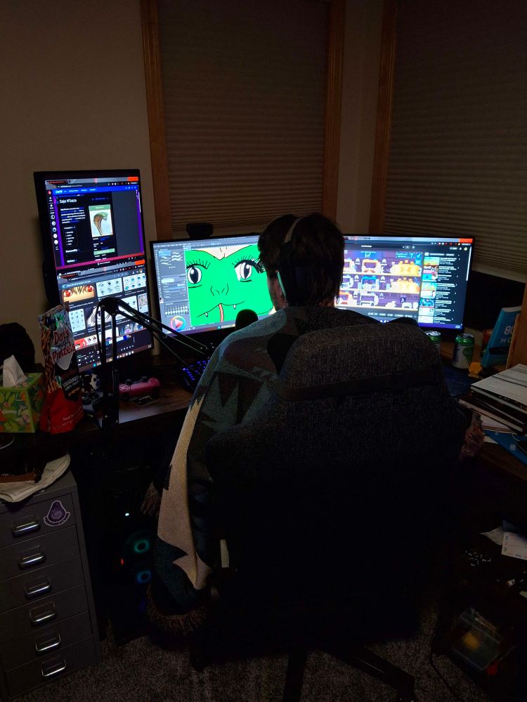 Me, using several references photos to create a poorly rendered snake lady on my computer.
