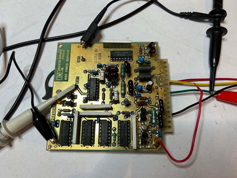 Closeup of a PCB with wires and probes