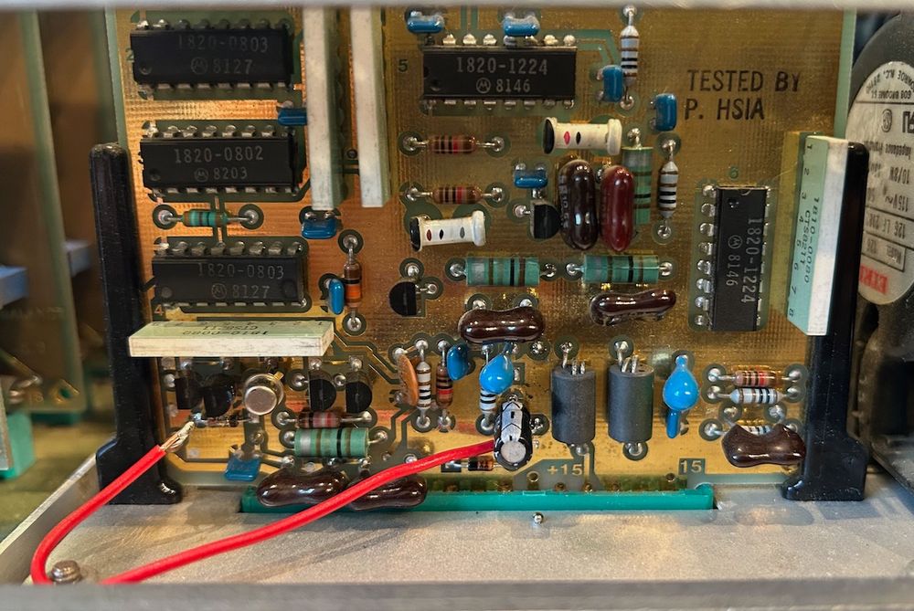 The reference frequency buffer PCB plugged into the chassis. There is a red bodge wire.