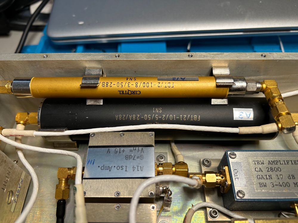 A gold and a black cylinder in the synthesizer. 