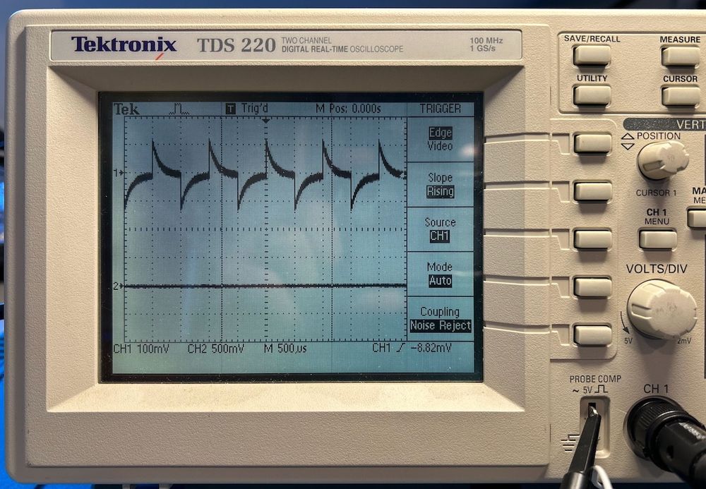 TDS220 screen showing probe compensation waveform that's definitely not right.