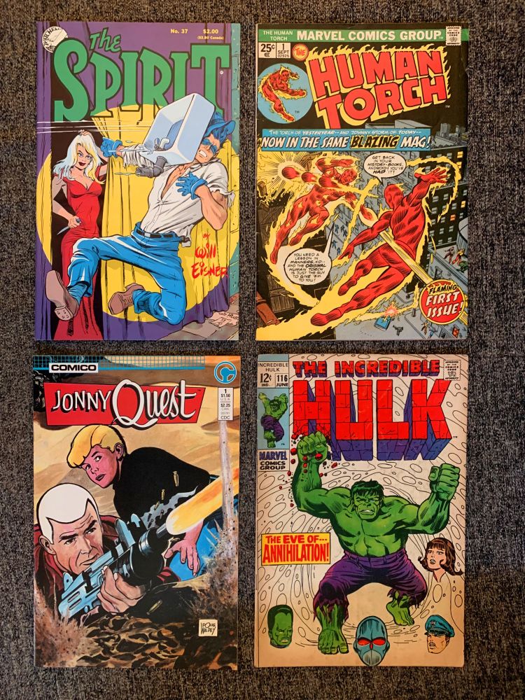 Photo of The Spirit #37, The Human Torch #1, Johnny Quest #1 and The Incredible Hulk #116