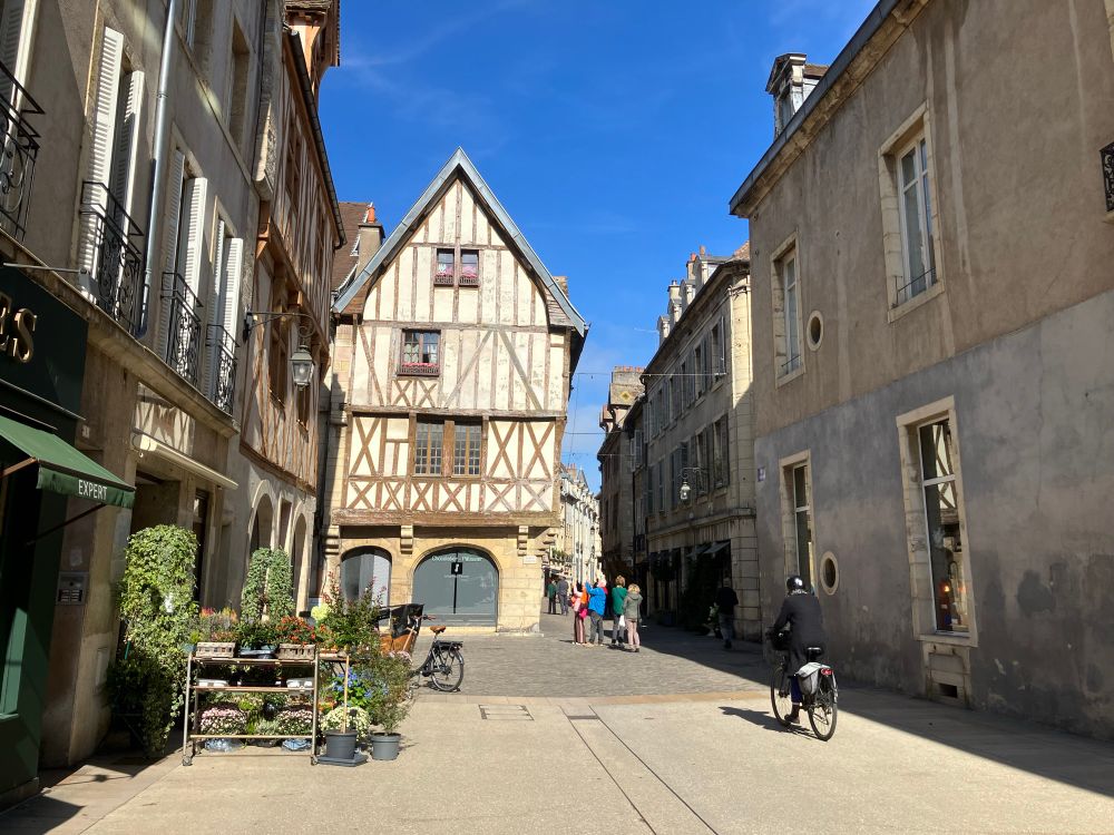 Timber framed medieval building with arched ground floor. 