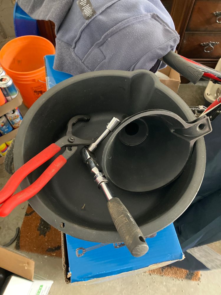 Oil pan/bucket, socket,  filter wrench and funnel 