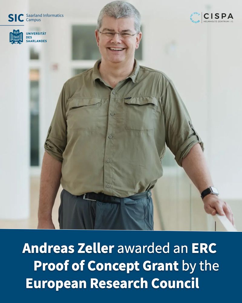CISPA Faculty member Prof. Dr. Andreas Zeller. In front of him, there's a banner that says "Andreas Zeller awarded an ERC Proof of Concept Grant by the European Research Council." Photo by: CISPA