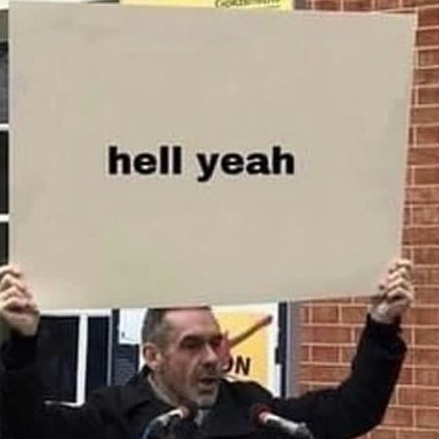 guy holding giant sign that says "hell yeah"