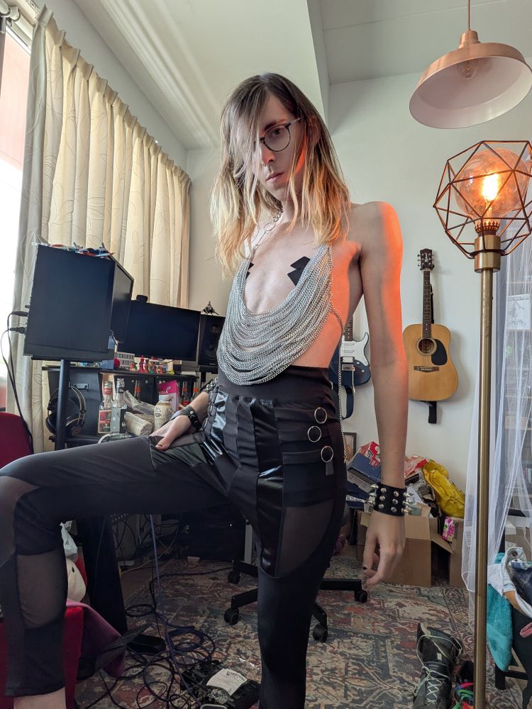 Tammy selfie wearing black sheer leggings, nipple pasties and a ringlet top.