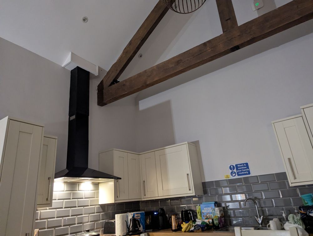 A kitchen with a high ceiling 