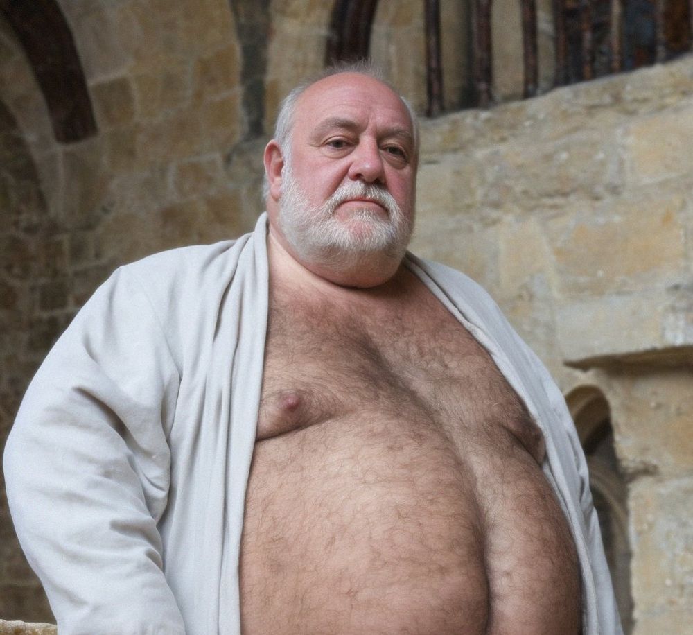 Artificially generated image of a older man with balding white hair and a white beard (that is patchy below the chin).  They are wearing a white, full-sleeve robe with the front open revealing chest and belly that has darker coloured fur/hair.  In the background is a stone-work brick wall that has a metal window grate.