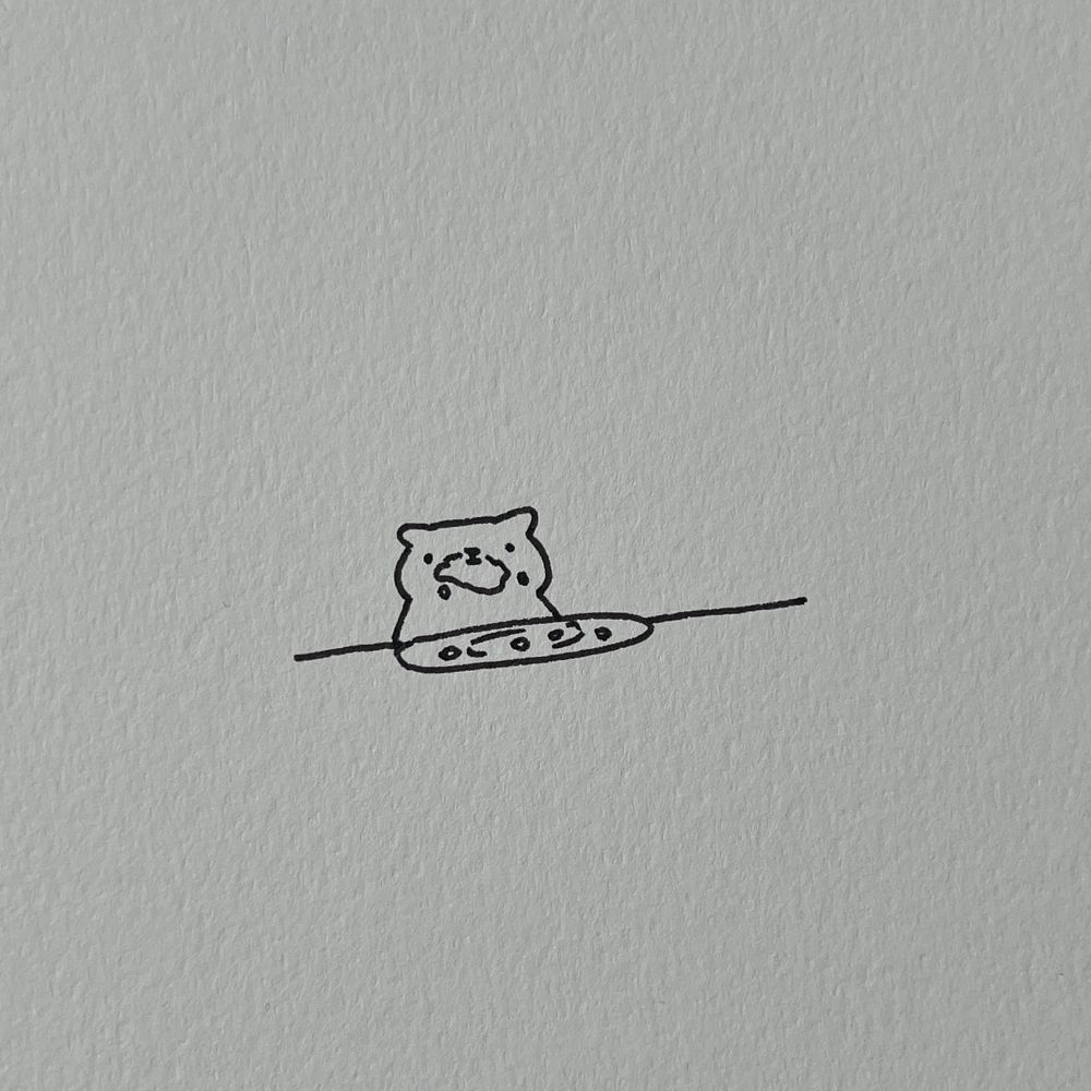 a doodle of a cat with crumbs on its face, staring blankly after a meal