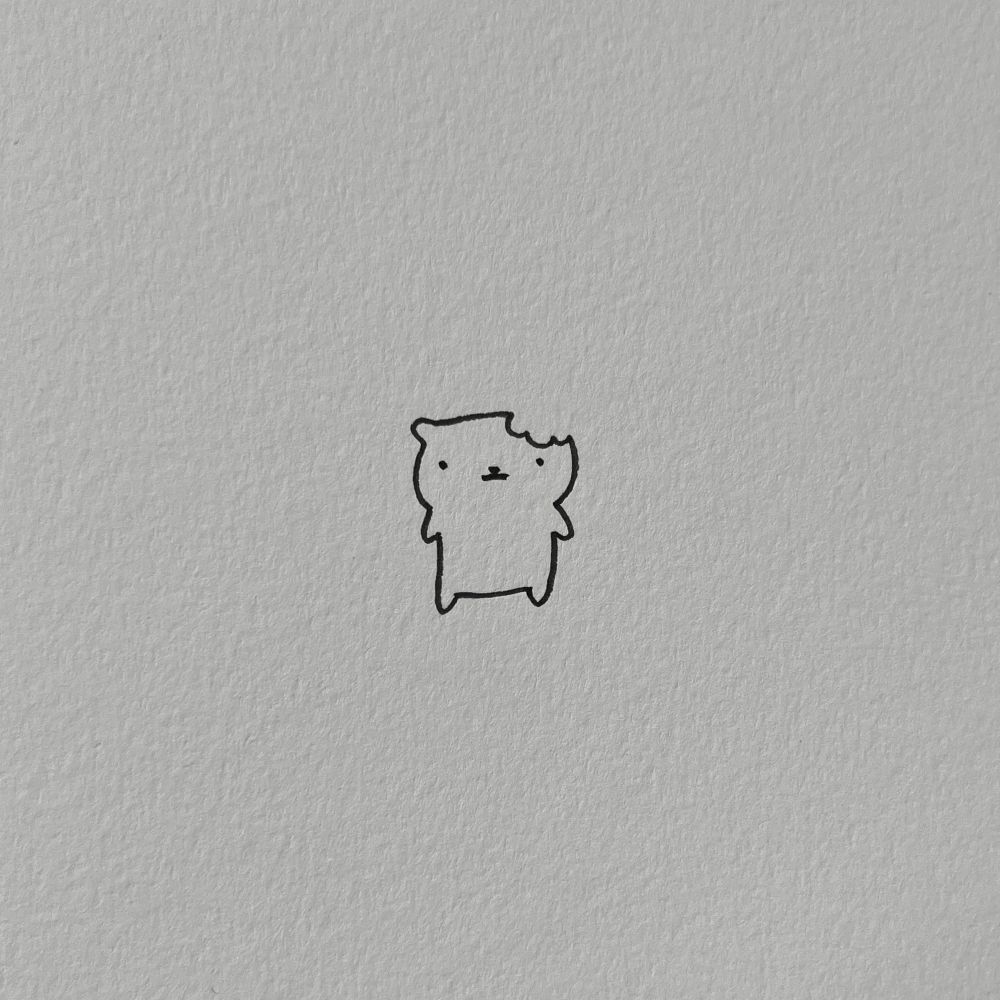 a doodle of a cat with a chunk missing from the top right of its head, resembling a bite mark