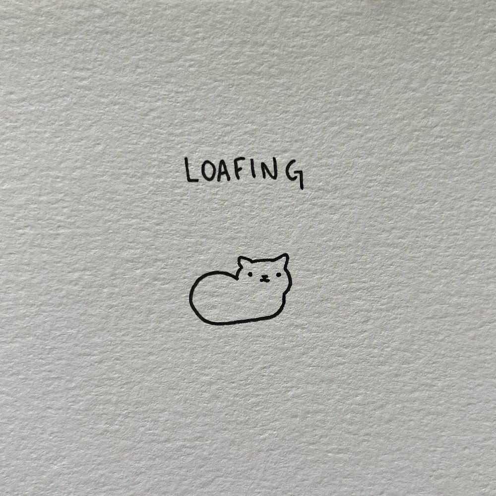 a doodle of a cat loafing