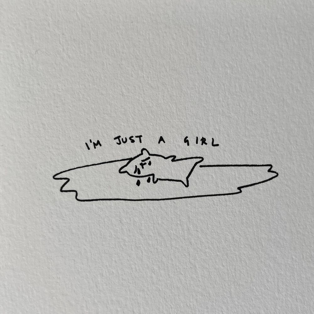 doodle of a crying cat lying on a puddle of its own tears, above it there’s a written text: “i’m just a girl”