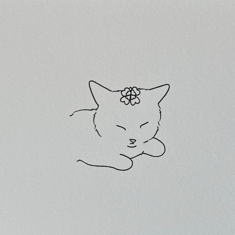 a poorly drawn kitten with closed eyes. a four-leaf clover rests on its head, symbolizing good luck 🍀 