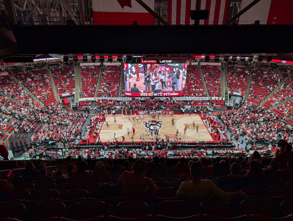 A picture of the NC State basketball court at the Lenovo Center from the top row at midcourt 
