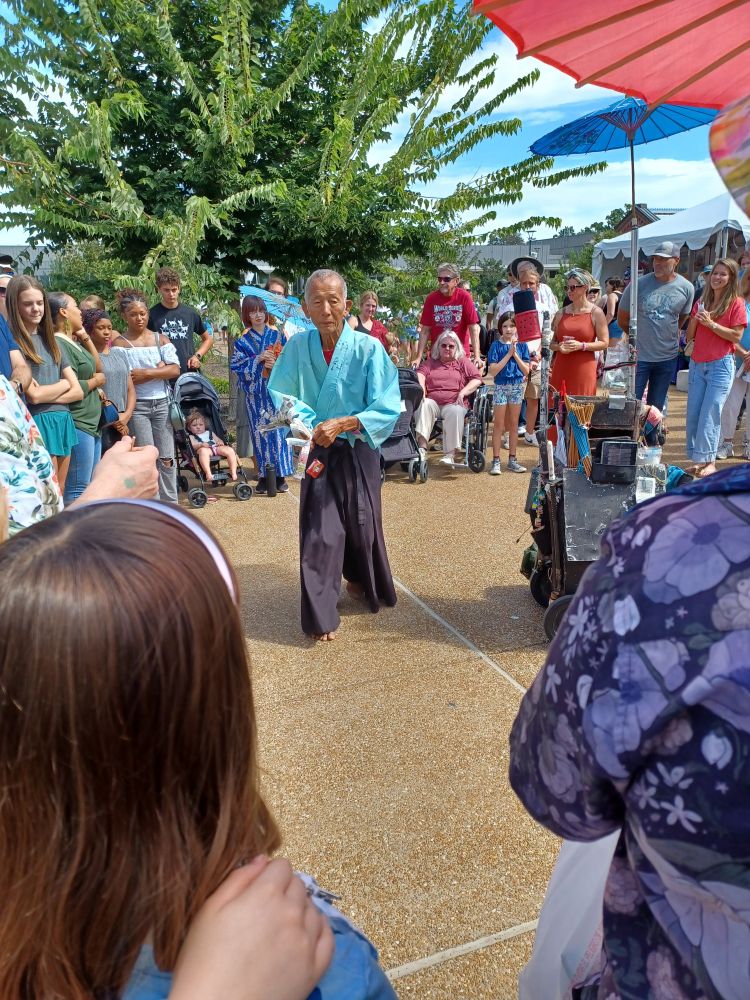 This guy was showing off some playful magic tricks. Really funny show. 