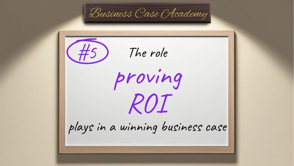 A sunlit wall with a whiteboard hanging on it with the words “#5 The role proving ROI plays in a winning business case” written on it, with “proving ROI” highlighted in purple, above which is a wooden nameplate reading "Business Case Academy".