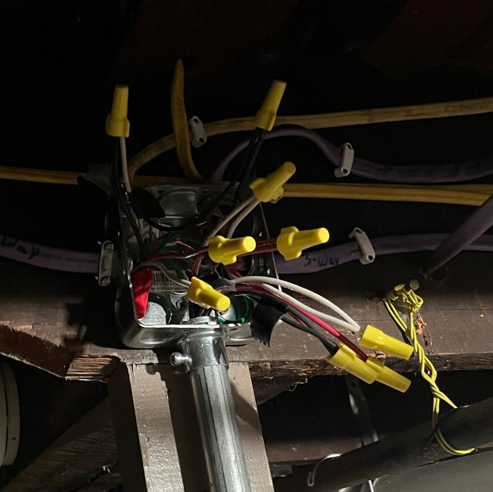 An 4” metal junction box with ~10 pairs of wires / yellow wire caps