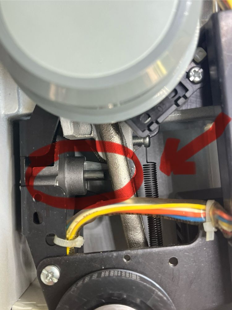 Sewing machine mechanism circled in red