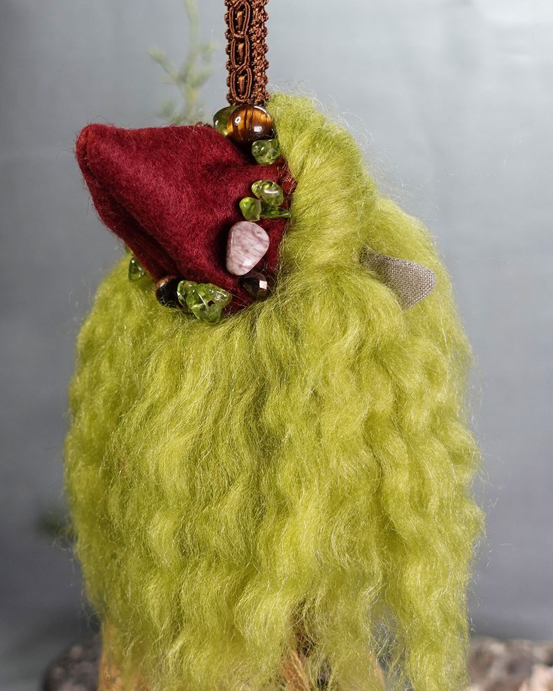 close up of jewelled gnome hat and green hair