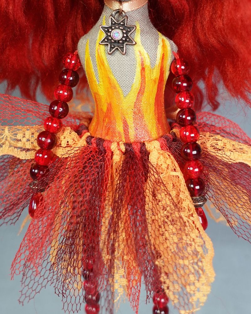 close up of hand painted flames and fiery effect tutu