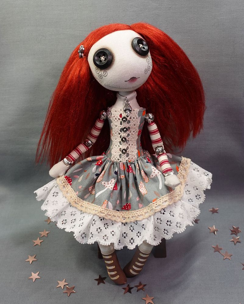 a button eyed textile art doll with red hair and mushroom print dress