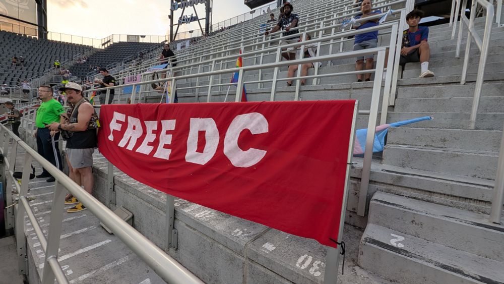 A photo of a red Free DC banner at Audi Field.