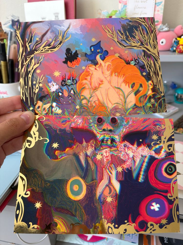 Two prints with gold foil, both fall-horror themed with the first print being pokemon and the second being both versions of the medicine seller from Mononoke 