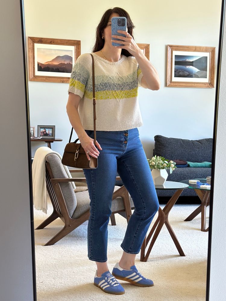 Woman wearing the Prismatic Reflection Tee with J Crew Stovepipe jeans, Adidas Gazelle indoor shoe, and H&M faux suede cross body bag