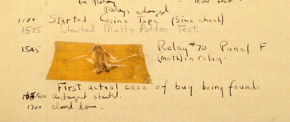 Picture of what is known as "The First Computer Bug": a moth taped with sticky tape into an old notebook, surrounded by hand writing 