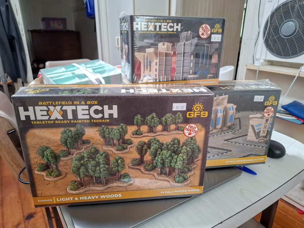 Three HexTech BattleTech terrain boxes.