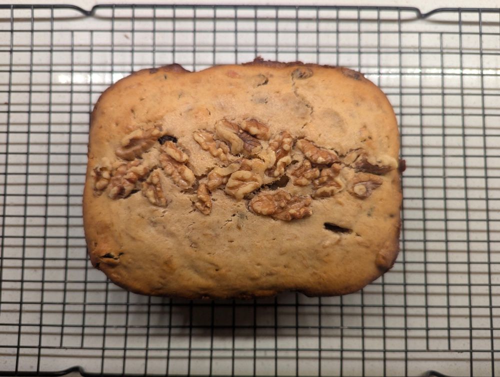 Banana bread cooling on a wire rack.