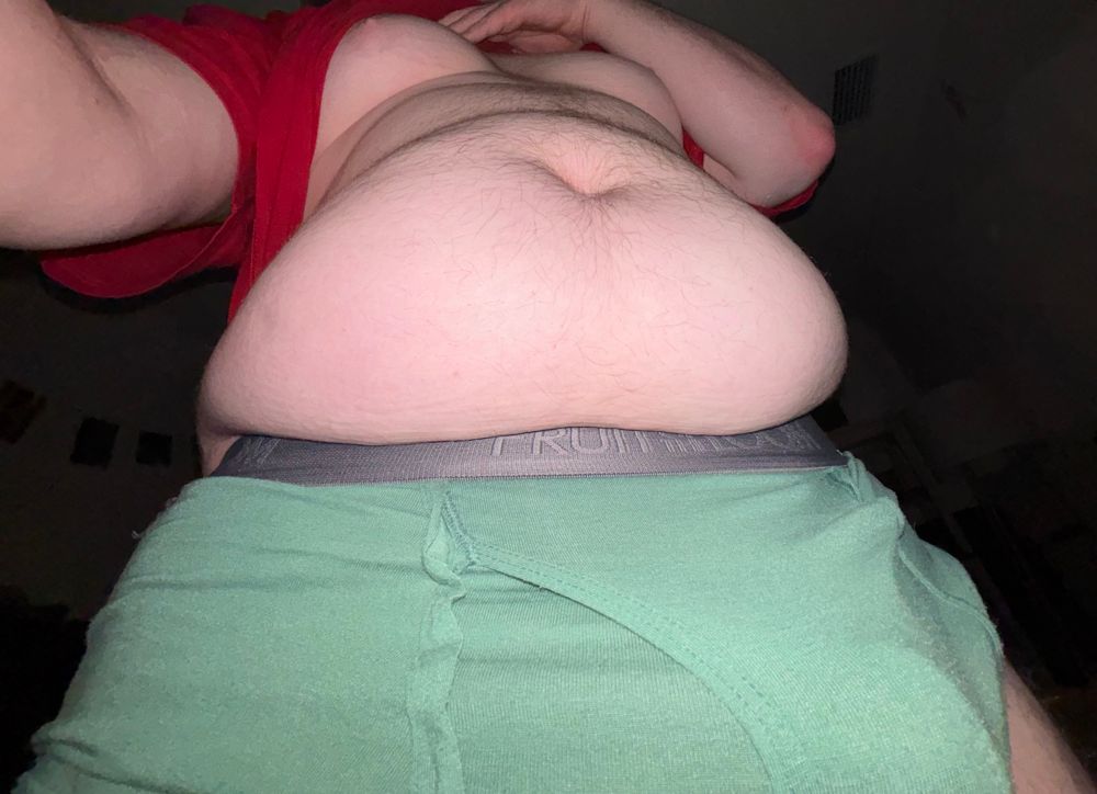 shot from below showing my stomach under my lifted shirt, more central view 