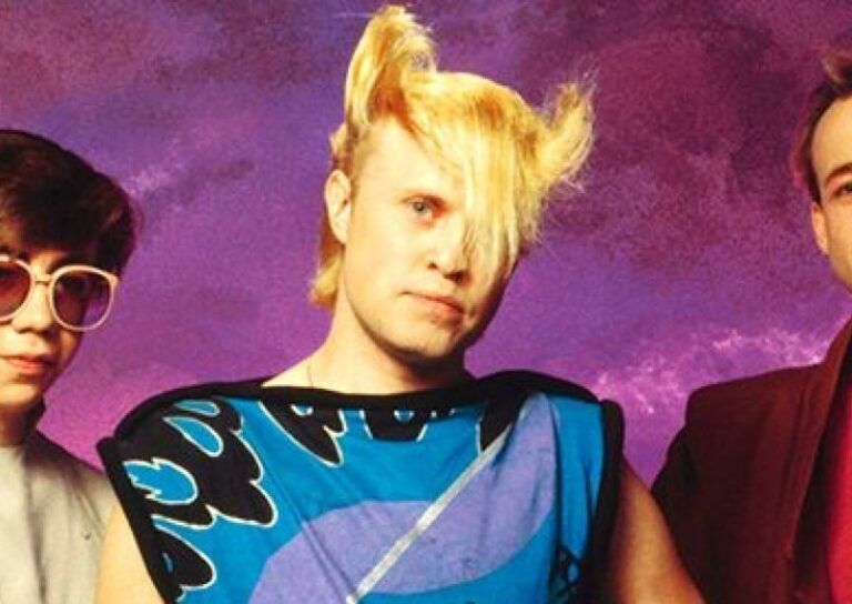member of the band Flock of Seagulls, sporting the hair that gained the same name. The sides go UP in a sort of owl horn way and the front is pulled forward covering one eye