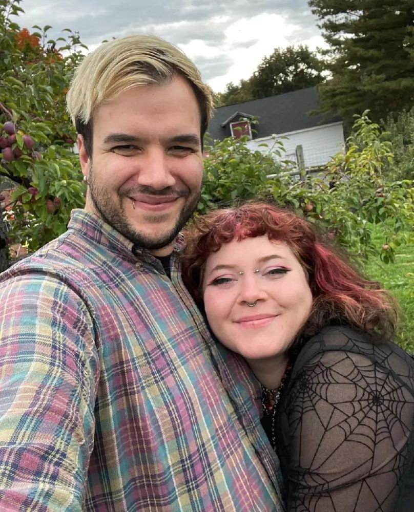 Nate and I hugging in an apple orchard 