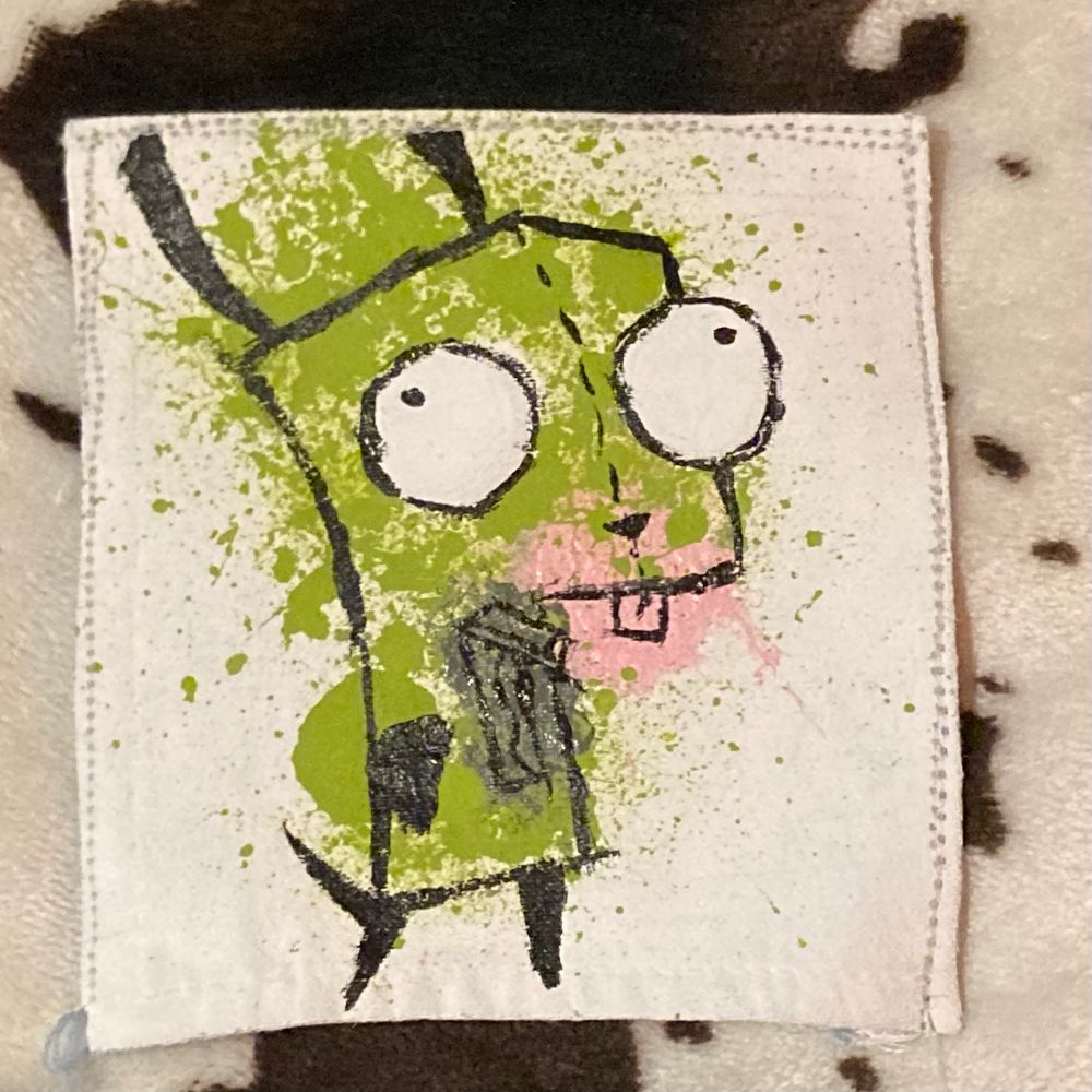 Gir from Invader Zim depicted on a pice of fabric