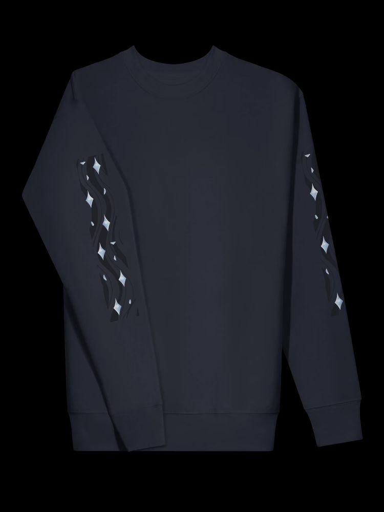 An image of a sweatshirt with swirled dark blue patterns and four pointed light blue gems on the sleeves, one sleeve more in front of the sweatshirt than the other to give a closer look.